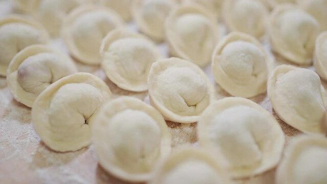 close-up dumplings in even rows. traditional Russian cuisine. homemade dumplings