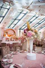 Beautiful composition of flowers decorating wedding table