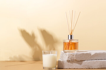 reed diffuser bottle on the podium. Incense sticks for the home with a floral scent with hard...