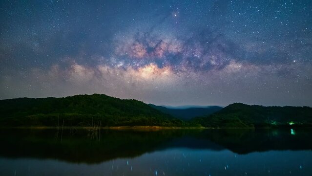 4K Panning timelapse of star and milky way reflected in the water, Ranong, Thailand 
