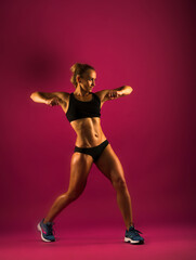 Obraz premium Fitness young woman in sports wear doing workout fitness aerobic exercise