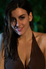 close-up of a beautiful woman smiling in a bikini with wet hair