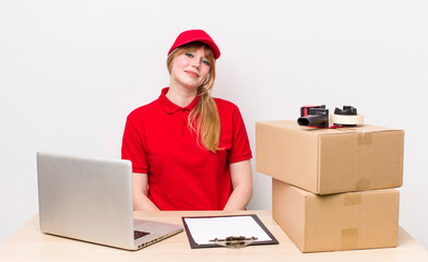 red head pretty woman smiling happily with a hand on hip and confident. employee concept