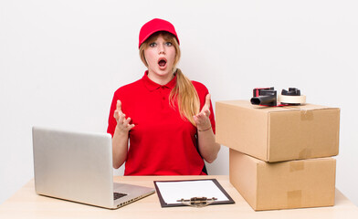 red head pretty woman feeling extremely shocked and surprised. employee concept