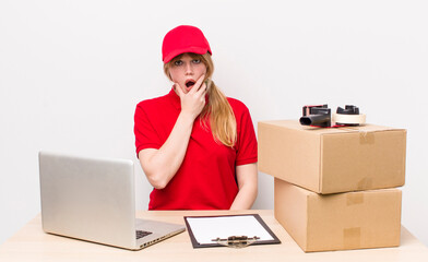 red head pretty woman with mouth and eyes wide open and hand on chin. employee concept