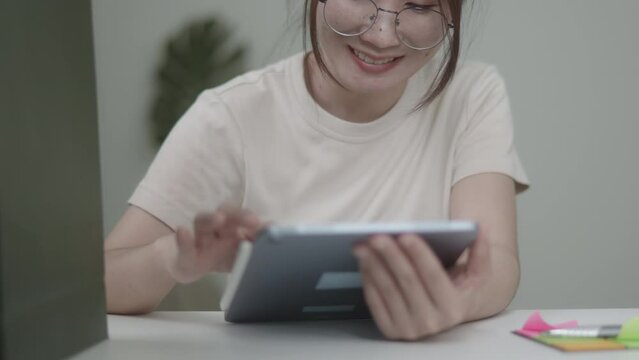 Young beautiful woman is shopping online and found amazing products that she interests. Then buying, paying and waiting for orders delivery to home. Shopping bag will be a gift. Soft focus and mood. 