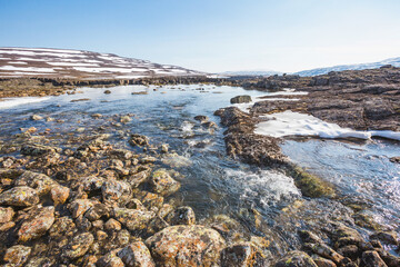 Melting water on Putorana Plateau, Russia. Krasnoyarsk region