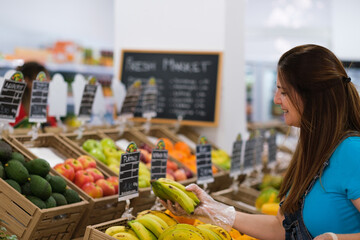 Senior woman choosing fruit in the market