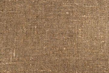 Fototapeta na wymiar Cloth. The texture of the burlap fabric is close-up. Packaging material. Background Of Burlap Hessian Sacking