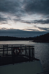 gray sky, dusk, sunset during ferry boat ride in the pacific northwest