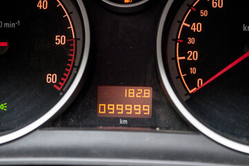 99 999 km in car. Speedometer in a car with a mileage indicator.