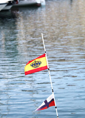 Flags of boats in a marina