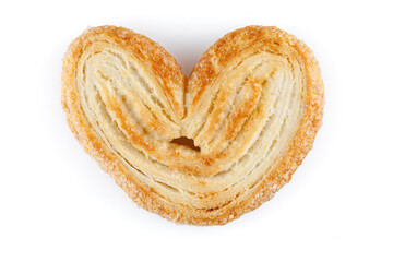 Palmier cookies or puff pastry ears isolated on white background. Cookies in the shape of a heart, top view. Close-up.