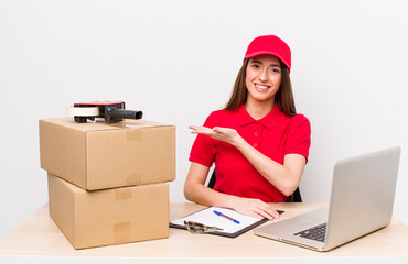 hispanic pretty woman smiling cheerfully, feeling happy and showing a concept. company employee...