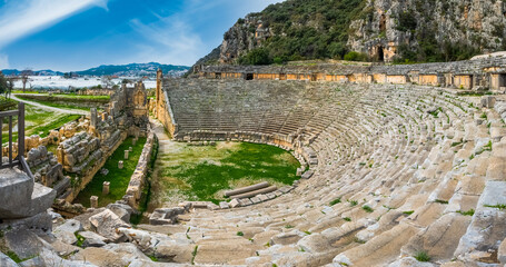 Panoramic view of Myra Ancient City Theater with Lycian rock-cut tombs. Demre, Antalya, Turkey