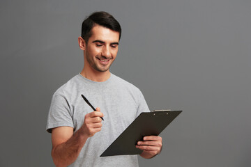 man folder for papers holding a pen posing lifestyle cropped view
