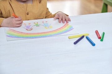 Crop child drawing LGBT family