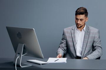 businessmen documents on the table computer work emotions technologies