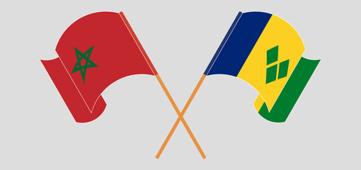 Crossed and waving flags of Morocco and Saint Vincent and the Grenadines