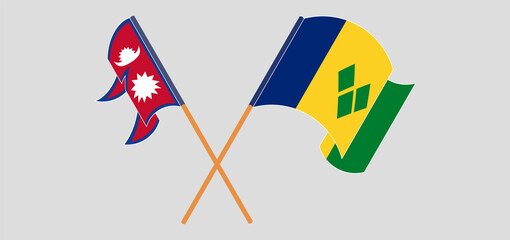 Crossed and waving flags of Nepal and Saint Vincent and the Grenadines