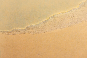 Fototapeta na wymiar Macro close up of a torn manila folder edge texture