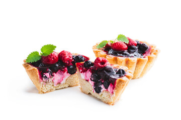 Delicious fruit tarts on wooden table