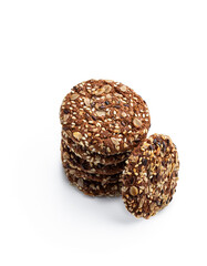 Healthy fitness cookies from sunflower seeds and sesame seeds with flax seeds isolated on white