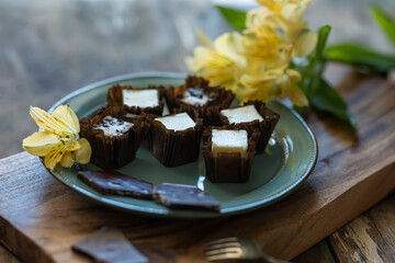 Delicate cottage cheese desserts and chocolate. Dark style. soft selective focus with shallow depth of field