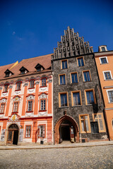Obraz premium Cheb, Western Bohemia, Czech Republic, 14 August 2021: King George of Podebrady Square, Eger at sunny summer day, medieval colorful gothic merchant, historic renaissance and baroque buildings