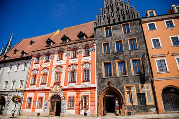 Fototapeta na wymiar Cheb, Western Bohemia, Czech Republic, 14 August 2021: King George of Podebrady Square, Eger at sunny summer day, medieval colorful gothic merchant, historic renaissance and baroque buildings