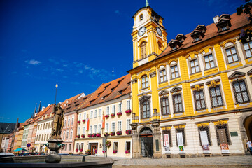 Cheb, Western Bohemia, Czech Republic, 14 August 2021: King George of Podebrady Square, Eger at sunny day, medieval colorful gothic historic renaissance and baroque buildings, town hall with tower