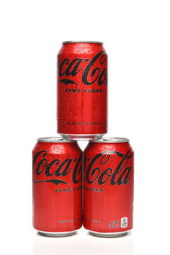 IRVINE, CALIFORNIA - 20 APR 2022: Three cans of Coca-Cola Zero soda isolated on white with condensation.