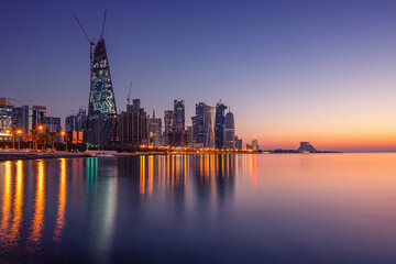 Naklejka premium Doha Skyline view early morning. Doha Corniche beach