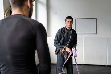 Brazilian jiu jitsu class at the academy male athletes preparing for training BJJ jiujitsu concept