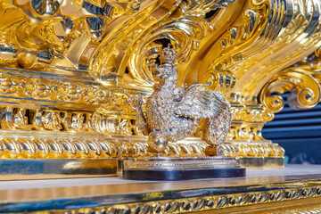 Golden Knocker (llamador) in the front of a paso (Platform or throne) of Holy Week