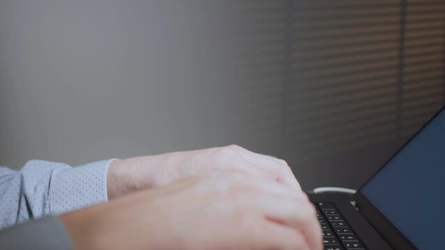 Developer working in computer in IT office, sitting at desk writing codes. Programmer typing data code, working on project in software development company. Terminal with coding language. 
