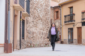Fototapeta na wymiar Buitrago de Lozoya local tourism in Madrid. Young Latin honduran woman travel on holiday trip