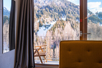 St. Anton am Arlberg. March 10, 2022. Beautiful mountain with trees viewed from bedroom of hotel,...