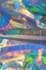 Holographic background. wallpaper In silver, purple and green colors.metal holographic material....