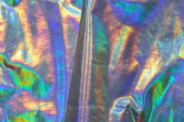 Holographic background. wallpaper In silver, purple and green colors.metal holographic material....