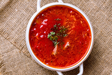 Borscht with sour cream on the bowl top view