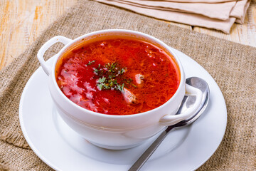 Borscht with sour cream on the bowl