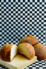 Artisan yolk bread, made in Oaxaca, Mexico. On black and white checkered background, restaurant style.
