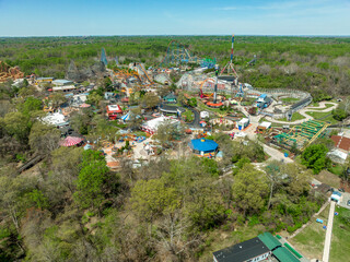 Aerial view of American amusement park with empty rides, roller coasters during the pandemic