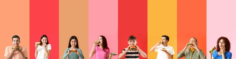 Fotobehang Kruidenier Group of people eating tasty sandwiches on color background with space for text  © Pixel-Shot