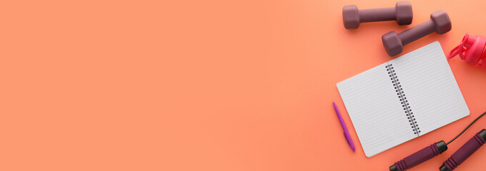 Sport equipment and blank notebook on color background with space for text