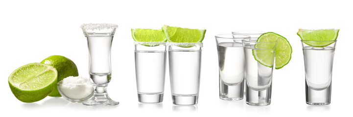 Set with shots of tasty tequila with lime and salt on white background