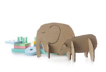 Handmade cardboard elephant, bear and educational toy on white background