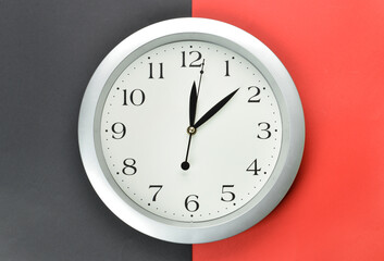 New modern clock on color background