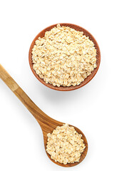 Bowl and spoon with raw oatmeal flakes on white background